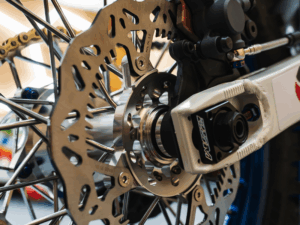 Cody Webb riding the EnduroCross Reno course with GBrakes dirt bike brake rotors installed, tackling the extreme rock garden section.