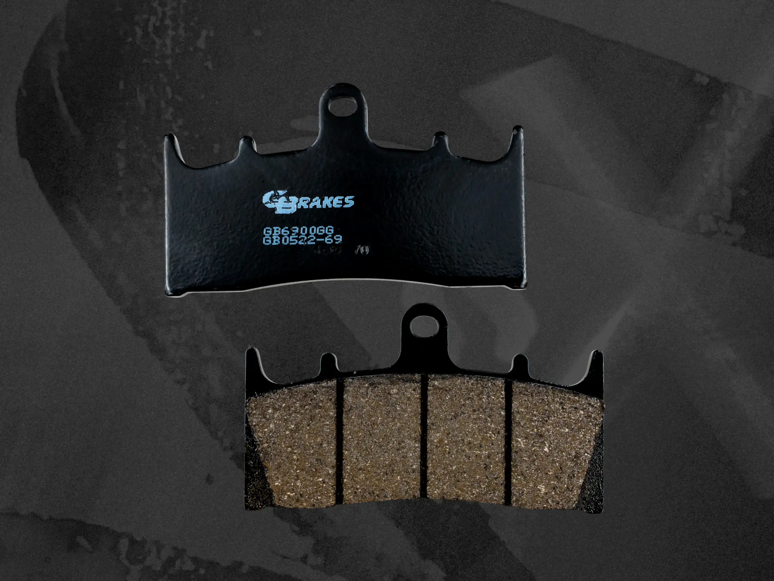 Close-up of GBrakes Harley-Davidson brake pads featuring Nucap NRS mechanical bonding technology for maximum braking strength and durability.